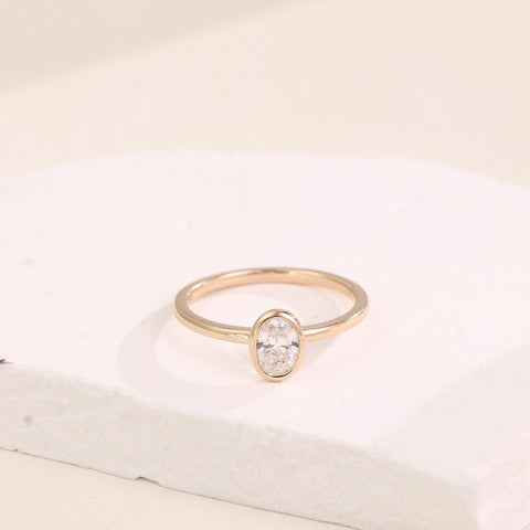 gold-bezel-oval-diamond-ring